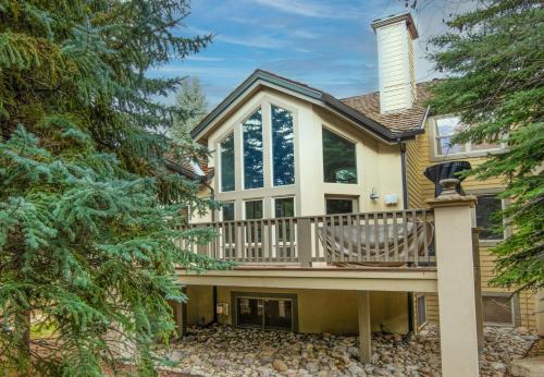 a house with a deck with a chair on it at Castle Peak Close in Edwards