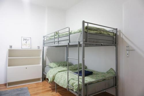 a bunk bed room with two bunk beds at Apartment in Gelsenkirchen - Gemütliche City-Suite in Gelsenkirchen