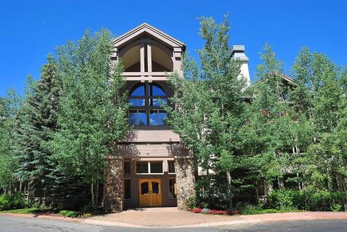 a building with a clock tower on top of it at Highlands Westview 300 condo in Beaver Creek