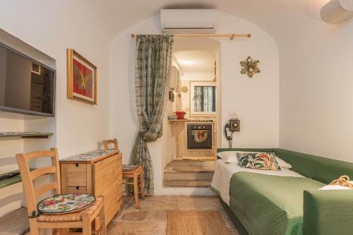 a bedroom with a bed and a couch and a fireplace at Extravacanza Central Station in Bari