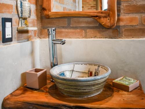 a sink with a faucet on top of it at Il Tano Suites in Punta Del Diablo