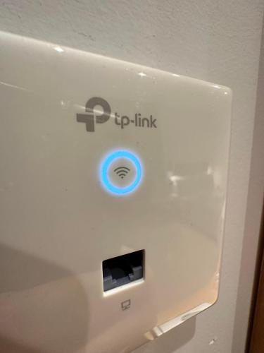a white refrigerator with an ipod link on it at Castro Hotel in Amoudara Herakliou