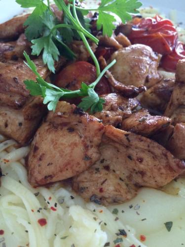 a plate of food with meat and rice and parsley at Bayraktar Hotel in Akcakoca