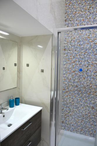a bathroom with a shower and a sink at Casa Chloé - vicino al Porto e Basilica San Nicola in Bari