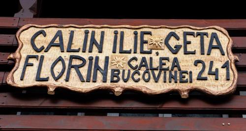a sign on the side of a building at Casa Calin in Câmpulung Moldovenesc