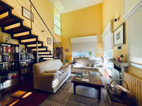 a living room with a couch and a table at O Souto de Monteasnal in Ourense