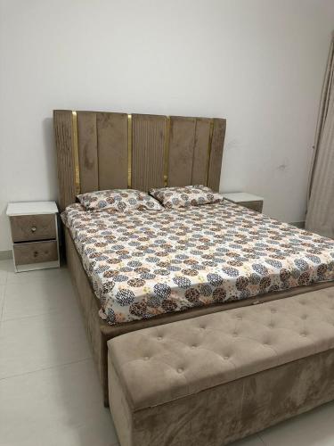 a bed in a bedroom with at Sherina Plaza 2 Flat 103 in Dubai