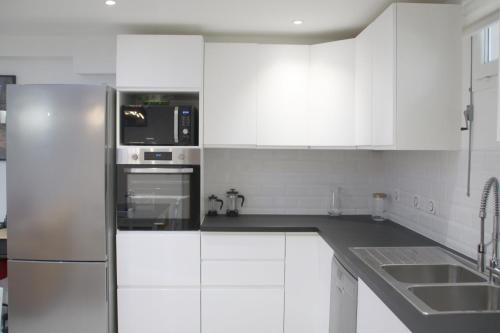 Η κουζίνα ή μικρή κουζίνα στο Appartement moderne & chaleureux près de La Défense