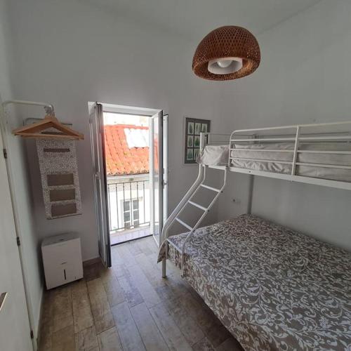 Ένα ή περισσότερα κρεβάτια σε δωμάτιο στο Centre old town rooftop apartment