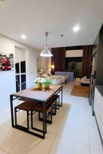 a living room with a dining table and a living room at [NEW LAUNCH] SUNRISE GURNEY SEAVIEW'63 无敌日出海景63 in George Town