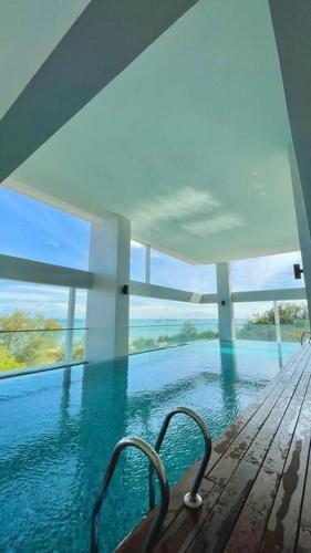 a view of a swimming pool in a house at [NEW LAUNCH] SUNRISE GURNEY SEAVIEW'63 无敌日出海景63 in George Town