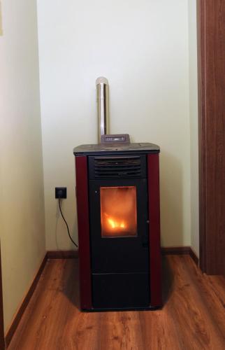 a small stove with a heater in a room at HEAVEN HOUSE in Kavala