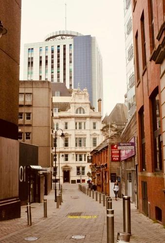 an empty street in a city with tall buildings at Centrally Located 3 Bed Apartment in Cardiff