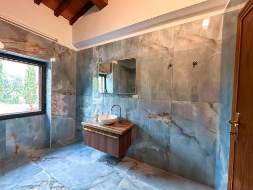 a bathroom with a sink and a mirror at Tenuta Massabò in San Casciano in Val di Pesa