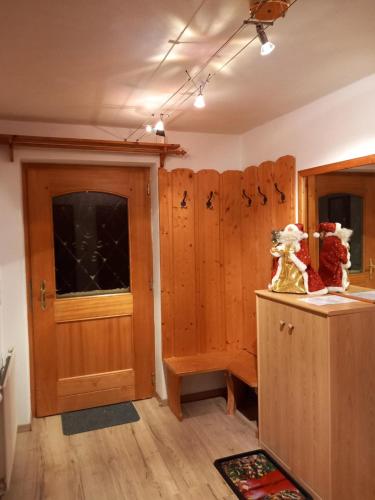 a room with wooden cabinets and a door at Landhaus-Königsberg, Vorberg 360 Ebengütlweg in Ramsau am Dachstein