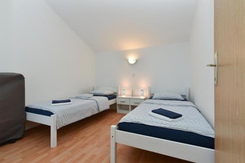 Postel nebo postele na pokoji v ubytování Apartment Mladen 1860