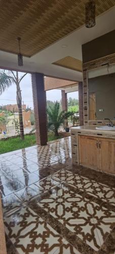 a large kitchen with a counter top and a table at Riad Khadija: Relax & Explore in Taroudant