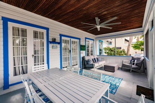 a porch with a table and chairs on a house at The Inn on Siesta Key in Siesta Key