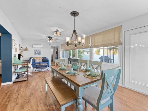 a dining room and living room with a table and chairs at Your Paradise in Venice - Near Beaches in Venice