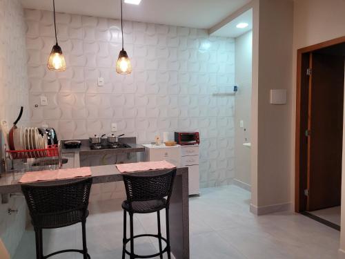 Η κουζίνα ή μικρή κουζίνα στο Flats Ipê