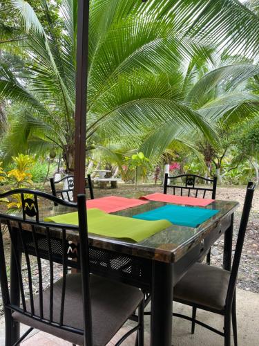 a table with two chairs and a colorful table at Secret Paradise in Cocles
