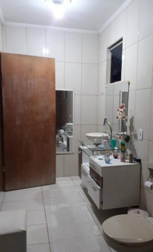 a bathroom with a sink and a toilet in it at Sítio casa grande in São Gonçalo do Amarante