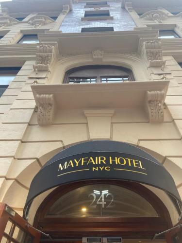 a building with a mayfair hotel sign over a doorway at The Mayfair Hotel Times Square, an Ascend Collection in New York