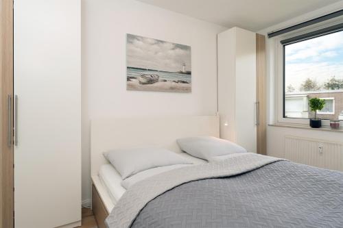 Postel nebo postele na pokoji v ubytování Höppnerweg 5 Seemöwe 18
