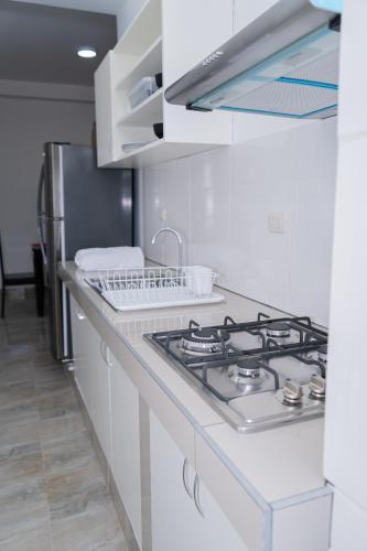 Una cocina o cocineta en Suite and Business