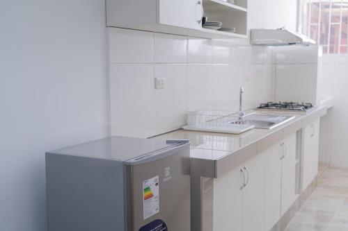 Una cocina o cocineta en Suite and Business