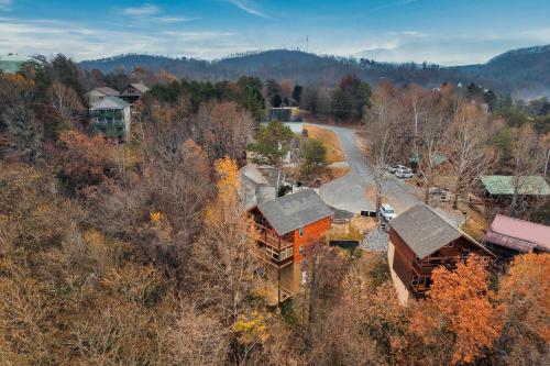 an aerial view of a house in the woods at Mountains r Calling, Cozy Hideaway, King Beds, Hot-Tub, Arcade, EV Ready in Pigeon Forge
