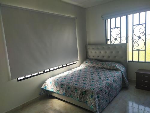 En eller flere senge i et værelse på CASA DE CAMPO LA VICTORIA
