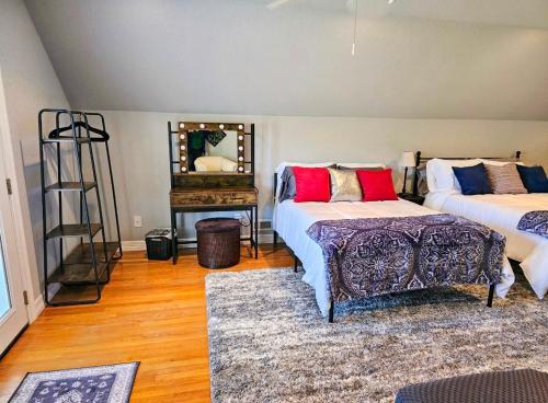 a living room with two beds and a table at Beaver Lake Hideaway in Lowell