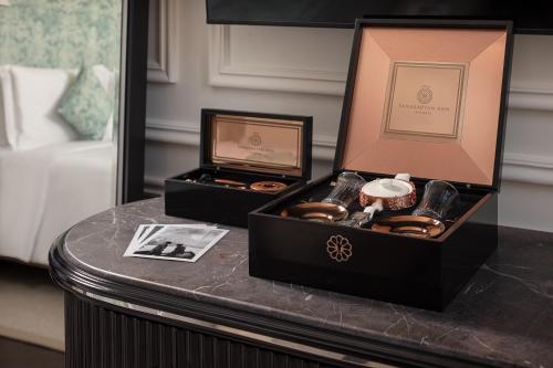 two boxes sitting on top of a table at Sanasaryan Han, a Luxury Collection Hotel, Istanbul in Istanbul