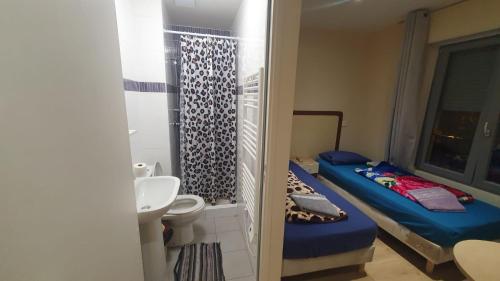 Ένα ή περισσότερα κρεβάτια σε δωμάτιο στο Hotel le Privilege
