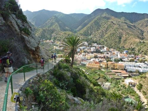 a group of people walking on a mountain trail at Casa Luisa Atico - Vallehermoso Centro Casco Antiguo in Vallehermoso