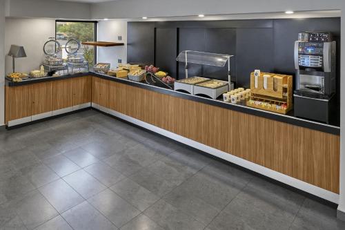 a kitchen with a counter and a counter top at City Express by Marriott Tijuana Rio in Tijuana