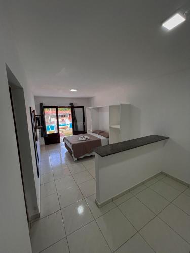 a bedroom with a bed and a large room at Verde Mar Pipa Beach in Pipa
