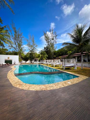 a swimming pool in the middle of a resort at Verde Mar Pipa Beach in Pipa