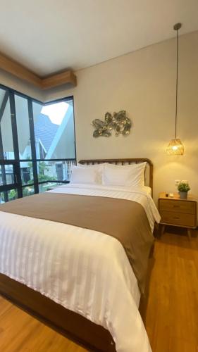Ένα ή περισσότερα κρεβάτια σε δωμάτιο στο Kallea Villas