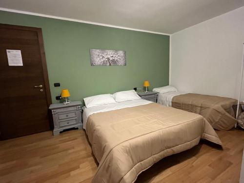Ένα ή περισσότερα κρεβάτια σε δωμάτιο στο B&B LE AMARENE