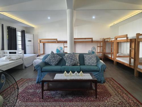 Postel nebo postele na pokoji v ubytování KUROSHARA Beach Resort