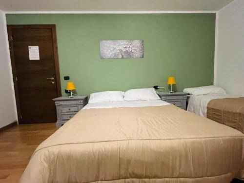 Ένα ή περισσότερα κρεβάτια σε δωμάτιο στο B&B LE AMARENE