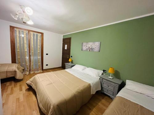 Ένα ή περισσότερα κρεβάτια σε δωμάτιο στο B&B LE AMARENE