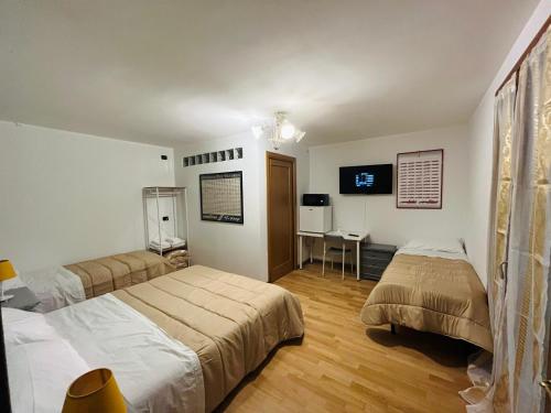 Ένα ή περισσότερα κρεβάτια σε δωμάτιο στο B&B LE AMARENE