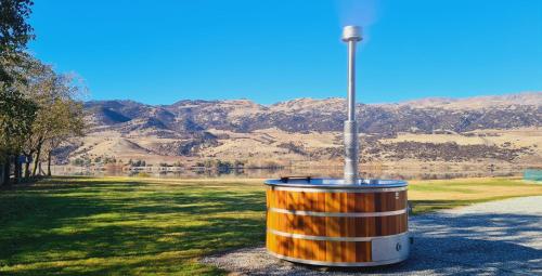a barrel sitting on the side of a road at Lakeside Retreat in Cromwell