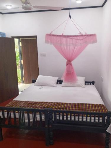 Ένα ή περισσότερα κρεβάτια σε δωμάτιο στο Su Casa Bentota