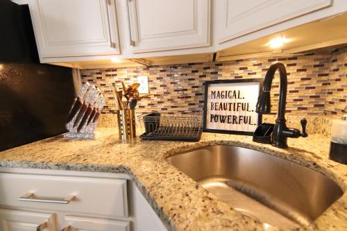 a kitchen with a sink and a counter top at Brooklyn Double Decker in Brooklyn