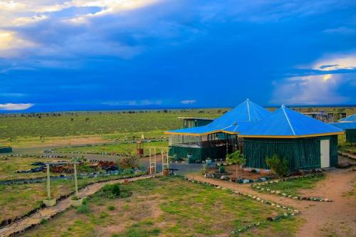 an overhead view of a farm with blue tents at Amanya 1-Bed Zebra Tent in Amboseli