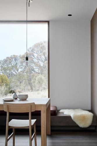 a dining room with a table and a window at Piermont Retreat in Swansea